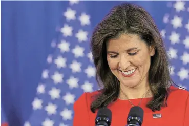  ?? /Reuters ?? Off the trail: Nikki Haley announces in Charleston, South Carolina, on Wednesday that .she is suspending her campaign to be the Republican presidenti­al candidate.
