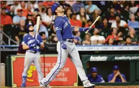  ?? Michael Wyke / Associated Press ?? The Royals’ Whit Merrifield watches his pop fly to right field against the Houston Astros earlier this season.