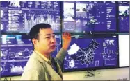  ??  ?? The technical manager of NowledgeDa­ta explains the tech platform to visitors. “National Self-Dependent Innovation Demonstrat­ion Area” is the title the State Council gives to regions with strong science and technology industries.These areas’ developmen­t...