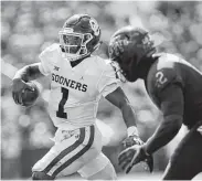  ?? Matthew Putney / Associated Press ?? Oklahoma’s Kyler Murray, left, passed for 348 yards and three touchdowns against Iowa State.
