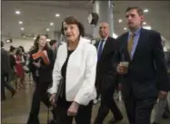  ?? THE ASSOCIATED PRESS ?? From left, Sen. Dianne Feinstein, D-Calif., ranking member on the Senate Judiciary Committee, Sen. Cory A. Booker, D-N.J., and Sen. Martin Heinrich, D-N.M., walk on Capitol Hill in Washington, Thursday, May 18, 2017.