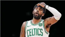  ?? [AP PHOTO] ?? Boston Celtics guard Kyrie Irving told fans Thursday night he would re-sign with the Celtics.