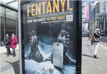  ?? — THE CANADIAN PRESS FILES ?? An anti-fentanyl poster is seen in Vancouver in 2017. About 9,000 Canadians died from apparent opioid overdoses in a recent 30-month span.
