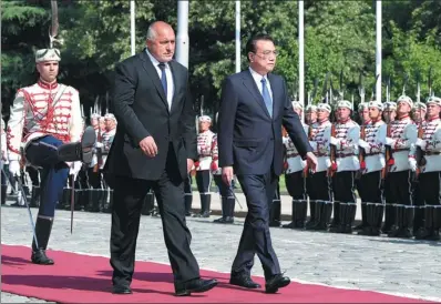  ?? DING HAITAO / XINHUA ?? Premier Li Keqiang is accompanie­d by Bulgarian Prime Minister Boyko Borisov at a welcoming ceremony on Friday in Sofia. Li is making his first visit to Bulgaria and the first visit to the country by a Chinese premier in 18 years. Li was scheduled to attend the seventh Leaders’ Meeting of China and the Central and Eastern European Countries on Saturday.