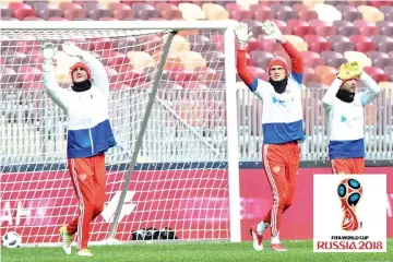  ?? AFP photo ?? From L: Russia’s goalkeeper­s Andrey Lunyov,Vladimir Gabulov and Igor Akinfeev take part in a training session at the Luzhniki stadium in Moscow on March 22, 2018, on the eve of a friendly football match between Russia and Brazil. -