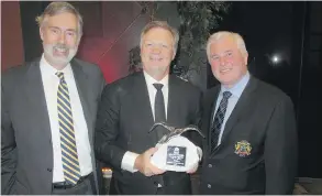  ??  ?? WestCreek Developmen­ts picked up the SAM Award for Community of the Year-City of Calgary. Pictured with the winning trophy is WestCreek Developmen­ts president Bravin Goldade, centre, who is flanked by Coun. Richard Pootmans, left, and Coun. Ward...