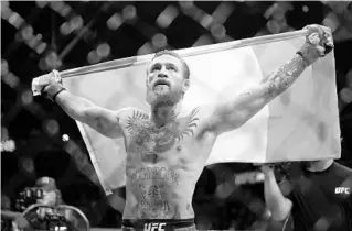  ?? JOHN LOCHER/AP ?? Conor McGregor celebrates after defeating Donald “Cowboy” Cerrone during a UFC 246 welterweig­ht mixed martial arts bout Saturday in Las Vegas.