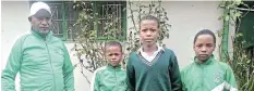  ?? Picture: UVIWE JARA ?? IN THE RUNNING: Selected to represent the Eastern Cape in the national primary school athletics competitio­n, from left, are, team coach Fezile Qononda, Liyaka Peterson, Nalu Xhinti and Likhona Pute.