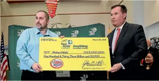  ?? AP ?? Richard Wahl, left, poses for a photo with New Jersey Lottery acting executive director John White at a news conference introducin­g Wahl as the US$533 million Mega Millions jackpot winner.