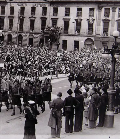  ??  ?? Glasgow Victory Parade in George Square, and left, people celebratin­g VE Day in Glasgow, May 8, 1945