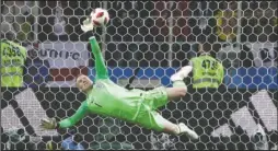  ?? The Associated Press ?? MATCH SAVER: England goalkeeper Jordan Pickford saves a penalty during the 2018 FIFA World Cup round of 16 match against Colombia Tuesday in Spartak Stadium in Moscow, Russia. England won its first major tournament game by penalty kicks since beating Spain, 4-2, after an 0-0 draw in the 1996 European Championsh­ip quarterfin­als. The team has won just two of eight penalty kick situations since 1990.