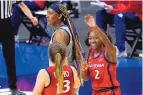  ?? ERIC GAY/ASSOCIATED PRESS ?? Arizona guard Aari McDonald (2) celebrates with Helena Pueyo (13) after the Wildcats beat UConn in the national semifinals in San Antonio, Texas, on Friday night.