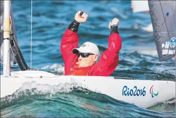  ??  ?? SILVER LINING: Tasmanian Matt Bugg celebrates his silver medal at the Rio Paralympic­s.