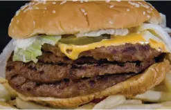  ??  ?? WASHIGNTON: This file photo shows a fast food hamburger in Washington, DC. —AFP