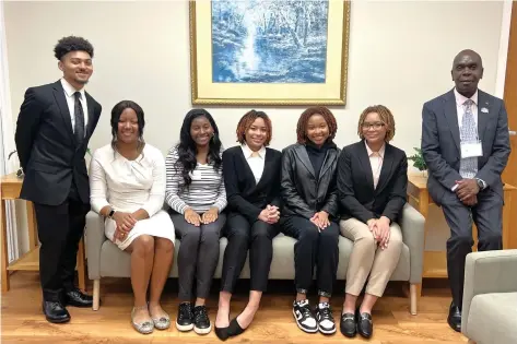  ?? (Special to The Commercial/University of Arkansas at Pine Bluff) ?? UAPB’s Student Observers Jude Kearney (from left), Elyse Wafer, Alexandria Collins, Maya Woods, Journee Greed, and Mia Woods sit and pose with the School of Arts & Sciences Interim Dean Grant Wangila. Student Makenzi Evans is not pictured.