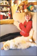  ?? Contribute­d photo ?? Lanaya Morris, 11, at her home in Torrington with the family cat.