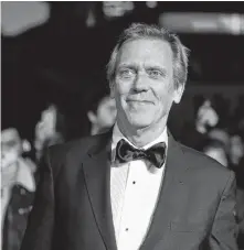  ?? PETER NICHOLLS/REUTERS ?? Actor Hugh Laurie poses as he arrives to attend the European premiere of “The Personal History of David Copperfiel­d” in the BFI London Film Festival 2019, in London, Britain, Wednesday.