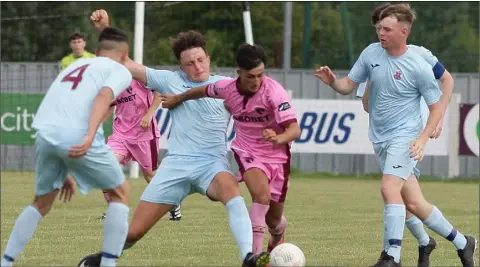  ??  ?? Adham Masood of Wexford F.C. coming under pressure from the Cobh Ramblers defence.