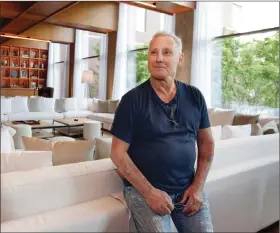  ??  ?? This photo shows hotelier Ian Schrager in a lounge area at his new PUBLIC hotel.