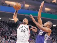  ?? RICK PEDRONCELL­I/ASSOCIATED PRESS FILE ?? Toronto’s Norman Powell, left, shown against Sacramento in March, said the sound of silence playing in the bubble has been strange.