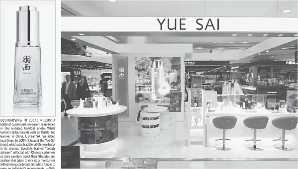  ??  ?? CUSTOMISIN­G TO LOCAL NEEDS: A bottle of customised skin serum is arranged in this undated handout photo. While building global brands such as Kiehl’s and Garnier in China, L’Oreal SA has added local lines. In 2004, it bought the Yue-Sai brand, which...