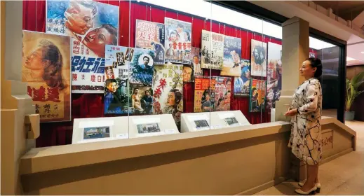  ??  ?? Historical records, posters and props used in early filmmaking and screening at cinemas were showcased to the public at the Haipai Culture Center in Hongkou District in June 2017. — Wang Rongjiang