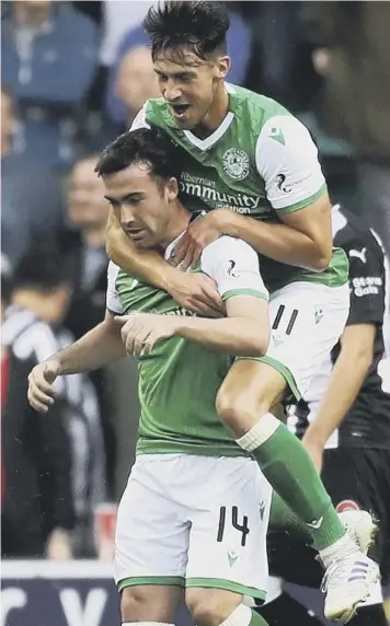  ??  ?? 0 Joe Newell joins Hibs team-mate Stevie Mallan to celebrate the opening goal against Newcastle.