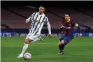  ?? Photograph: David Ramos/Getty Images ?? Messi chases Ronaldo during Juventus’s 3-0 win at Barcelona in December that clinched the Italian side a place in the Champions League knockout phase.