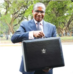  ??  ?? Finance and Economic Developmen­t Minister Professor Mthuli Ncube arrives at Parliament for the 2019 National Budget presentati­on in Harare, yesterday. — (Pictures by Tawanda Mudimu)