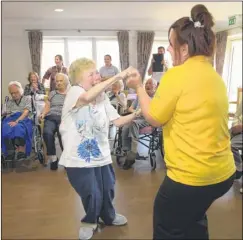  ?? FM4539418/FM4539428 Buy these photos at kentonline.co.uk ?? Student dancers from Spires Academy at the Meadow View Care Home, Hersden and, right, Cat Payne dances with activities manager Christina York Pictures: Tony Flashman