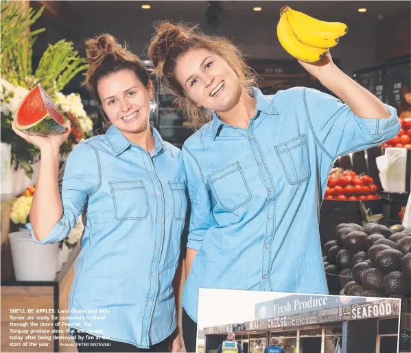  ?? Picture: PETER RISTEVSKI ?? SHE’LL BE APPLES: Larni Chafer and Milly Turner are ready for customers to flood through the doors of Peaches, the Torquay produce store that will reopen today after being destroyed by fire at the start of the year.