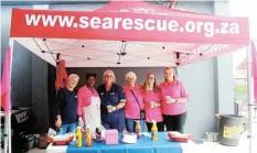  ?? ?? SUPPORT FOR FUNDRAISER: NSRI Survival Swimming coordinato­rs and volunteers sell boerewors rolls at BUCO’s new store opening to raise funds for the programme.