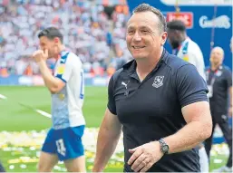  ?? Pictures: SNS Group/ Shuttersto­ck. ?? Left: Micky Mellon, who has stressed to his new squad that they should not be going into their Premiershi­p campaign with an inferiorit­y complex against anyone after winning the Championsh­ip title last season; above: The manager celebratin­g on the Wembley pitch after leading Tranmere Rovers to promotion to Division One after beating Newport County in the Sky Bet EFL League 2 playoff final in May 2019.