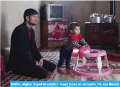  ?? — AFP ?? KABUL: Afghan Sayed Assadullah Pooya looks on alongside his son Donald Trump during an interview on Friday.