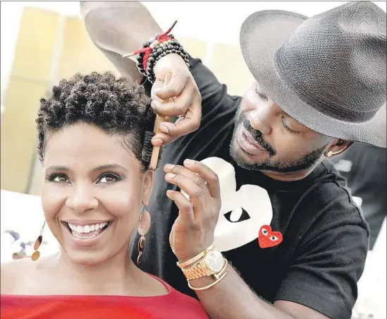  ?? Kirk McKoy Los Angeles Times ?? SANAA Lathan, with stylist Larry Sims, stars in “Nappily Ever After,” about a black woman’s relationsh­ip with her hair. For one scene, she really had her head shaved.