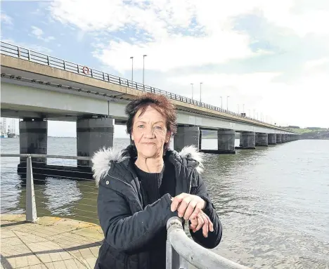  ??  ?? A DUNDEE woman with a fear of bridges tackled her phobia head on in a bid to win her daughter a dream wedding.
Moira Mason, 60, a counter colleague at Asda, has feared bridges ever since she fainted on a diving board. She plummeted into the...