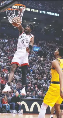  ?? NICK TURCHIARO/USA TODAY SPORTS ?? Raptors guard Terence Davis slams a dunk-shot Sunday in Toronto’s 127-81 win over the Indiana Pacers.