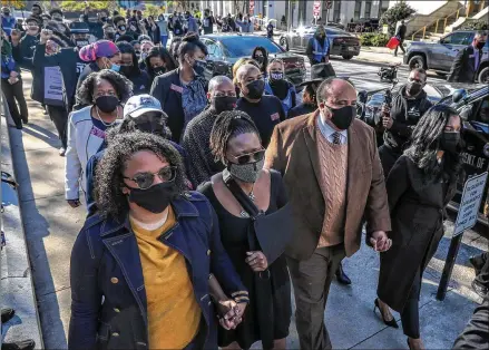  ?? JOHN SPINK / JOHN.SPINK@AJC.COM ?? State Rep. Park Cannon, accompanie­d by Martin Luther King III and a throng of other supporters, returned Monday to the Capitol for the first time since she was arrested after knocking on Gov. Brian Kemp’s office door Thursday.