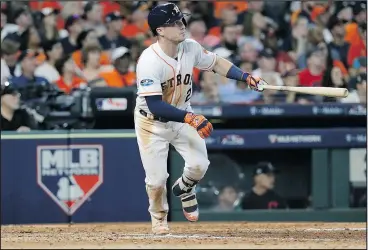  ?? — THE ASSOCIATED PRESS ?? Houston Astros’ Alex Bregman watches his solo home run against Cleveland Indians’ pitcher Trevor Bauer during of Game 2 of the ALDS.