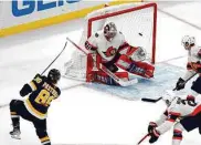 ?? Michael Dwyer/Associated Press ?? The Bruins' David Pastrnak scores one of his two goals in Monday's win over the Senators in Boston.