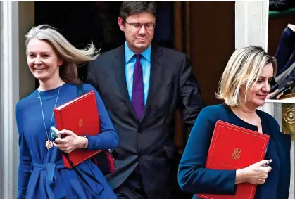  ??  ?? OPENING SALVO: Liz Truss, far left, leaves 10 Downing Street last week with Greg Clark and Amber Rudd. She said Ministers were like ‘vultures’, below, in seeking money from Mr Hammond, above