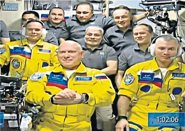  ?? ?? In this screen grab from a video provided by Roscosmos, the Russian space agency, cosmonauts Sergey Korsakov, Oleg Artemyev and Denis Matveyev are welcomed on to the Internatio­nal Space Station