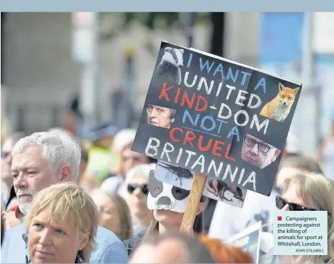  ?? JOHN STILLWELL ?? Campaigner­s protesting against the killing of animals for sport at Whitehall, London.