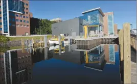  ?? "1 1)050 ?? The Great Lakes Research Center is reflected in the waters of the docking area with RV Agassiz ready to go at Michigan Tech University in Houghton, Mich.