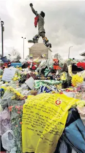  ??  ?? Pain: Tributes on a Galatasara­y shirt from a Turkish fan at the Billy Bremner statue on Elland Road; (top right) Kevin Speight with his son George and (below) Chris Loftus