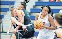  ?? [BRYAN TERRY/THE OKLAHOMAN] ?? Moore's Aaliyah Moore gains control of the basketball as Norman North's Kennedy Cummings, left, and Fatima Black collide during a girls high school game Jan. 21 in Moore.