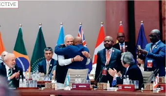  ?? ﬃG#$ X ACCOUNTﬀ ?? Indian Prime Minister Narendra Modi and Azali Assoumani, chairperso­n of the AU, hug each other as the AU became a permanent member of the G20 in New Delhi, India, on 9 September 2023