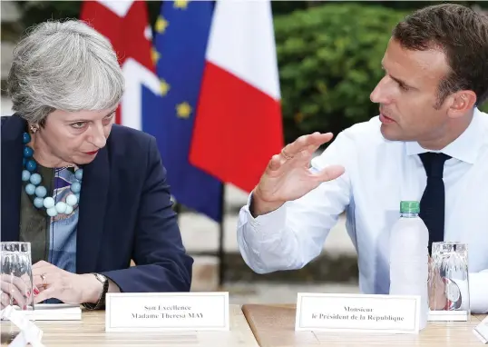  ??  ?? Le crunch: Theresa May and Emmanuel Macron hold talks over Brexit at his Riviera retreat Fort Bragancon yesterday