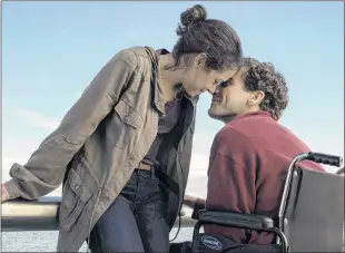  ?? THE CANADIAN PRESS ?? This image released by Roadside Attraction­s shows Tatiana Maslany, left, and Jake Gyllenhaal in a scene from “Stronger.”