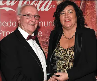  ??  ?? Valerie Sherlock from the Westcourt Hotel presents Tomás O hEochaidh with the Hall of Fame award at the Drogheda Independen­t Sport Star of the Year Awards.